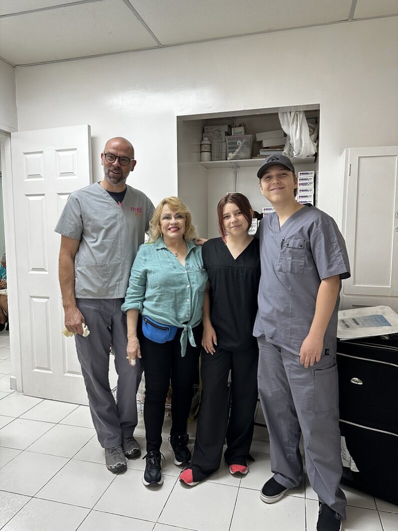 Group photo with Christopher Miles, left. He specialises in lymphoedema and conducted training sessions for the volunteers